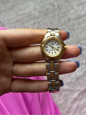 Anne Klein Two-Tone Gold and Silver Bracelet Watch
requires a battery